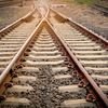 Two sets of train tracks converge.