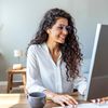 Smiling woman working at a computer