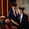 Staff from hospitality industry working in front of laptop together