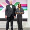 Photo of Ed McQuiston, chief customer officer at Hyland, and award recepient