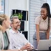 four coworkers conversing