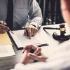 Two people discussing legal documents