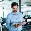 A man looking at a tablet