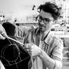Fashion designer takes measurements on a fashion bust.