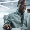 A cloud architect learns about the power of cloud-native content services as they read an e-book on their laptop.