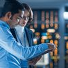 In technology research facility: female project manager talks with chief engineer