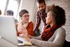three adults having a work discussion