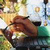 Person uses a stylus on a keyboard.