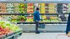 Man shopping for organic fruits and vegetables in fresh produce section