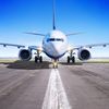 Commercial airplane sits on the tarmac.