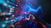 Hand reaching towards glowing digital data on a futuristic screen.