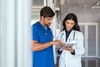 Healthcare professionals having a discussion with a tablet