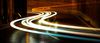 Long exposure of cars driving on a road.