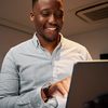 A person seeking a content services platform reads an analyst report on a tablet.