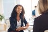 Female employees talking and smiling