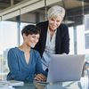 Two women looking at the computer screen