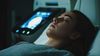Patient with eyes closed undergoing a scan
