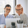 two_women_discussing_352894664
