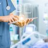 Doctor using cloud-based imaging program on tablet in a hospital 