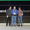 Hyland senior vice president and chief strategy officer Chris Winczewski (left) and president and CEO Jitesh Ghai (right) are joined by Matt Seagren from Erie Insurance, which won this year?s Digital Visionary of the Year Award at Hyland?s annual Innovation Awards.