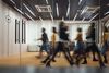 Busy people moving through office environment