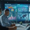A group of professionals are having a meeting in conference room, surrounded by large digital screens displaying data visualizations and charts.