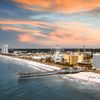 Aerial shot of Myrtle Beach showing a Ferris wheel and pier.