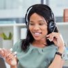 A consultant in a headset talks to a customer about their assessment results.