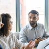 Colleagues discuss how to successfully implement their next IT project.