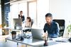 People working on cloud-based platforms in an office.