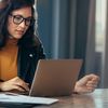 Business woman busy working on laptop computer at office