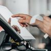 Retail worker uses a point-of-sales system.
